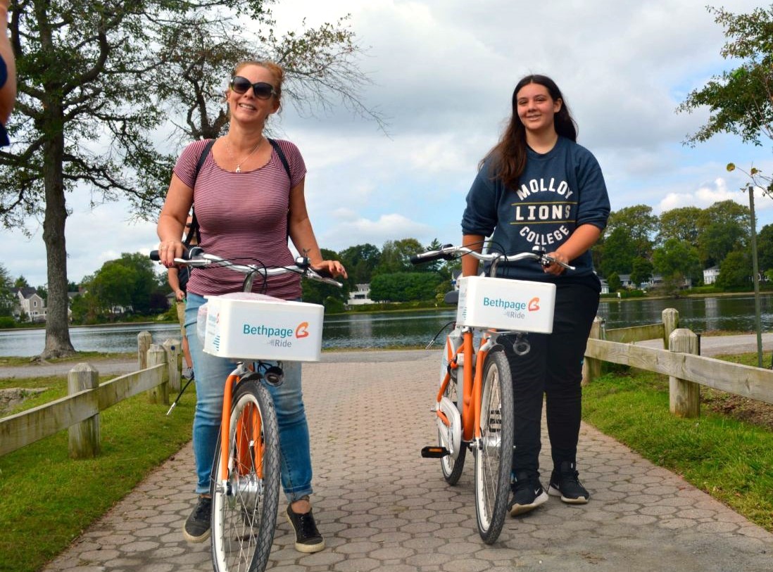 2 people riding bike share bikes